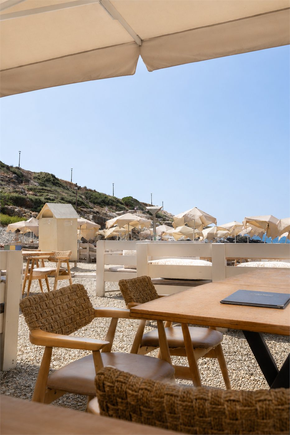 Shaded terrace with a view of the bay and the hills